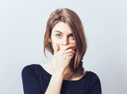 woman covering mouth - rhode island age of consent